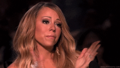 mariah carey applauds closing her eyes