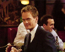 Barney Stinson winks smiling.