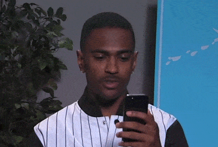 Man is suspicious looking at his mobile phone.