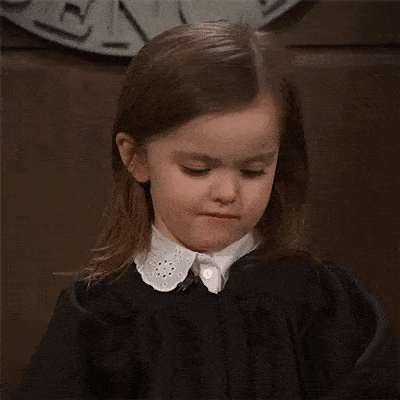 A little girl pouting.