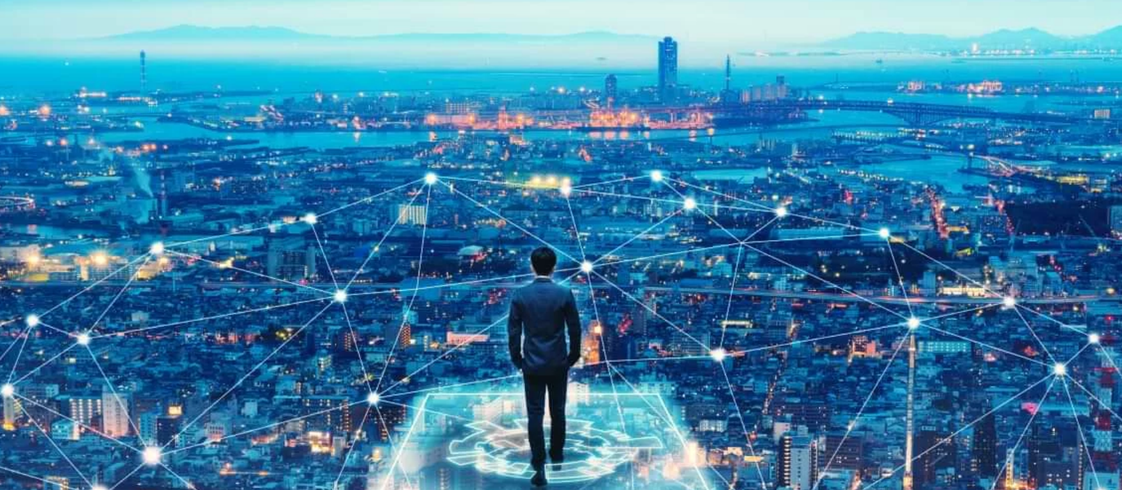 A man stands at the edge of a virtual network extending across a city.